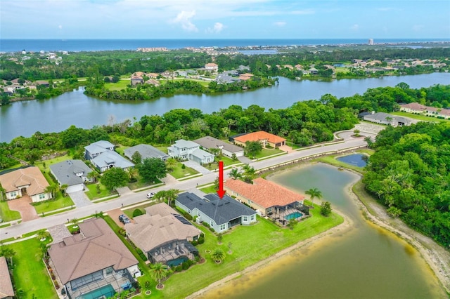 67 N Lakewalk Dr, Palm Coast, FL 32137 - aerial perspective of suburban area featuring a nearby body of water and a tree filled landscape