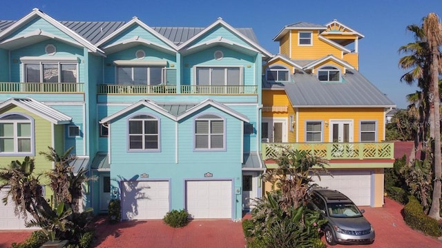 3000 Ocean Shore Blvd Unit 18, Ormond Beach, FL 32176 - view of front of home with decorative driveway, a garage, and a metal roof