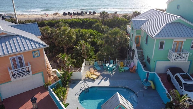 3000 Ocean Shore Blvd Unit 18, Ormond Beach, FL 32176 - view of swimming pool with stairs and view of water and beach