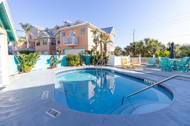 3000 Ocean Shore Blvd Unit 18, Ormond Beach, FL 32176 - community pool with a fenced backyard and a patio area