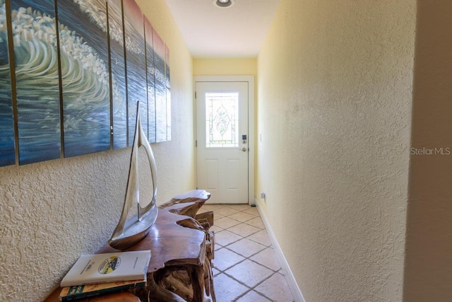 3000 Ocean Shore Blvd Unit 18, Ormond Beach, FL 32176 - doorway to outside with a textured wall and tile patterned flooring
