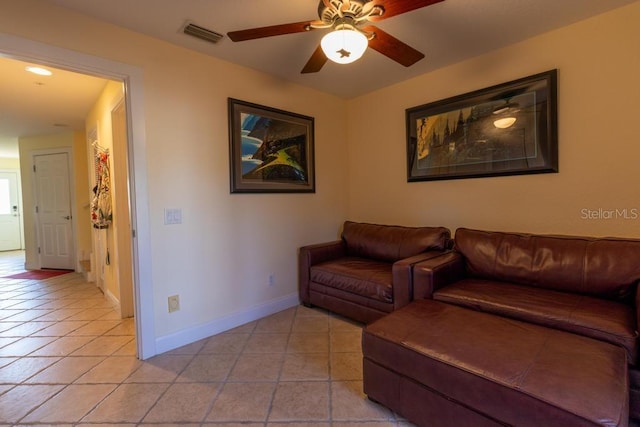 3000 Ocean Shore Blvd Unit 18, Ormond Beach, FL 32176 - living room with light tile patterned floors and a ceiling fan