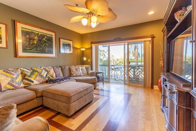 3000 Ocean Shore Blvd Unit 18, Ormond Beach, FL 32176 - living area with light wood-style flooring and ceiling fan