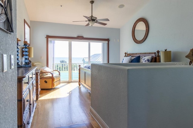 3000 Ocean Shore Blvd Unit 18, Ormond Beach, FL 32176 - living area featuring wood finished floors, ceiling fan, and vaulted ceiling