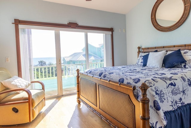 3000 Ocean Shore Blvd Unit 18, Ormond Beach, FL 32176 - bedroom with light wood-style flooring, multiple windows, and access to outside