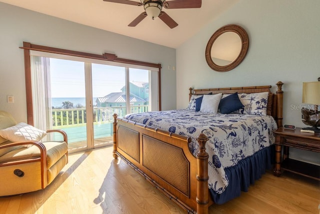 3000 Ocean Shore Blvd Unit 18, Ormond Beach, FL 32176 - bedroom featuring light wood-style flooring, access to outside, lofted ceiling, and a ceiling fan