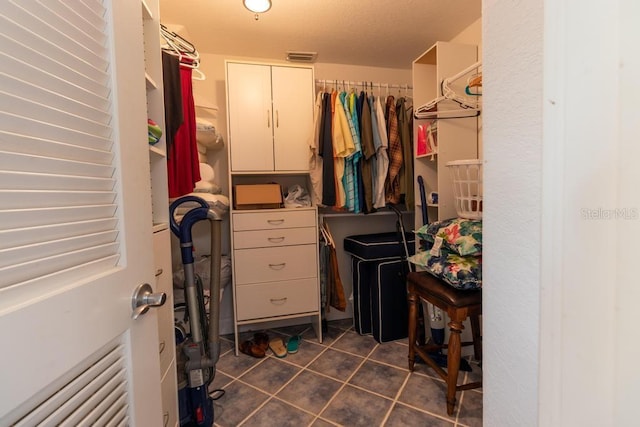3000 Ocean Shore Blvd Unit 18, Ormond Beach, FL 32176 - walk in closet with dark tile patterned flooring