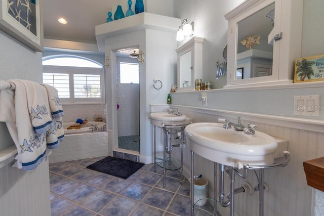3000 Ocean Shore Blvd Unit 18, Ormond Beach, FL 32176 - full bathroom featuring a bath, wainscoting, tile patterned floors, and a tile shower