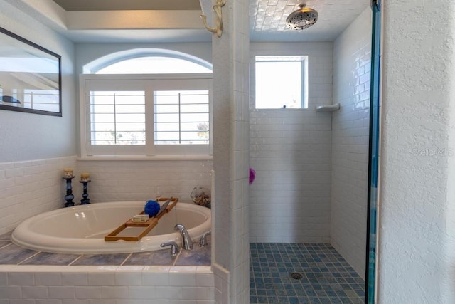 3000 Ocean Shore Blvd Unit 18, Ormond Beach, FL 32176 - full bathroom with a shower stall, a bath, and tile patterned flooring
