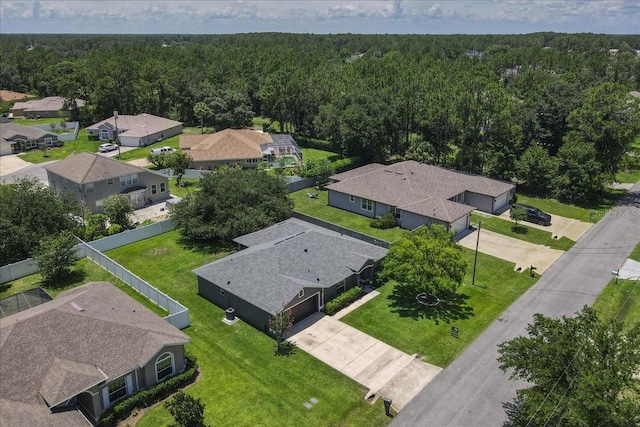 37 Lindsay Dr, Palm Coast, FL 32137 - aerial perspective of suburban area with a heavily wooded area