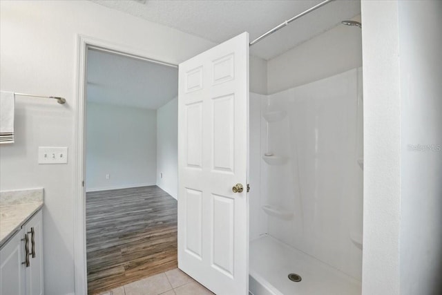 37 Lindsay Dr, Palm Coast, FL 32137 - full bathroom with vanity, tile patterned floors, and a shower