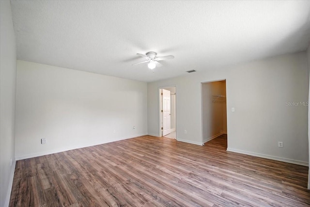 37 Lindsay Dr, Palm Coast, FL 32137 - spare room with a ceiling fan and wood finished floors