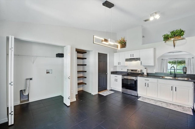 37 Lindsay Dr, Palm Coast, FL 32137 - kitchen featuring stainless steel range with electric stovetop, under cabinet range hood, dark countertops, arched walkways, and high vaulted ceiling