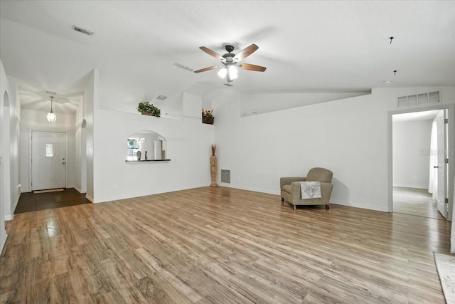 37 Lindsay Dr, Palm Coast, FL 32137 - unfurnished living room with ceiling fan, lofted ceiling, and wood finished floors
