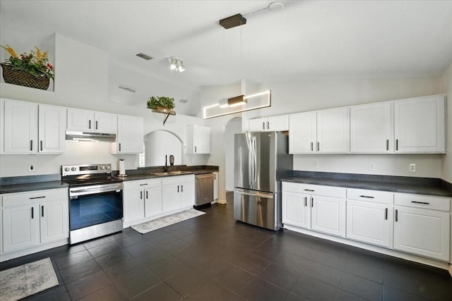 37 Lindsay Dr, Palm Coast, FL 32137 - kitchen featuring appliances with stainless steel finishes, under cabinet range hood, dark countertops, and high vaulted ceiling