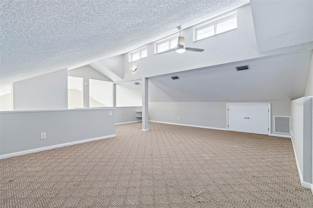1115 N Central Ave, Flagler Beach, FL 32136 - additional living space featuring carpet, ceiling fan, lofted ceiling, and a textured ceiling