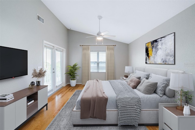 1115 N Central Ave, Flagler Beach, FL 32136 - bedroom with lofted ceiling, light wood-type flooring, and a ceiling fan