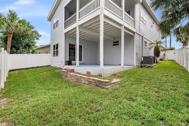 1115 N Central Ave, Flagler Beach, FL 32136 - rear view of house with a patio area, stucco siding, and a fenced backyard