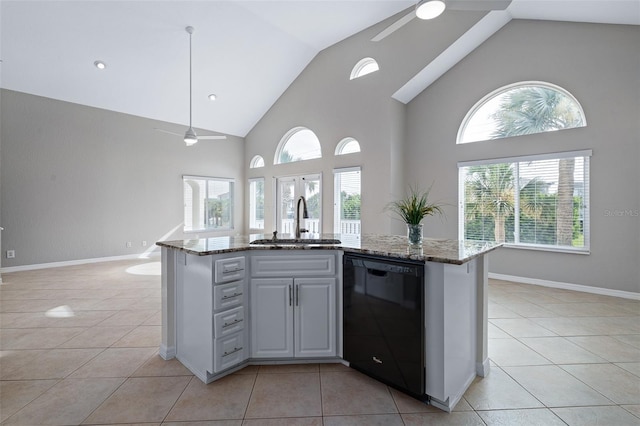 1115 N Central Ave, Flagler Beach, FL 32136 - kitchen with black dishwasher, ceiling fan, open floor plan, light stone counters, and high vaulted ceiling