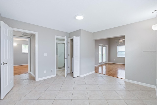 1115 N Central Ave, Flagler Beach, FL 32136 - unfurnished bedroom with light tile patterned flooring