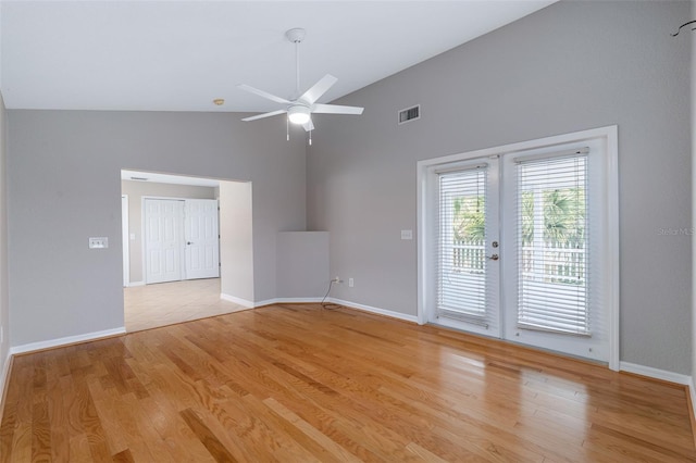 1115 N Central Ave, Flagler Beach, FL 32136 - unfurnished room with french doors, high vaulted ceiling, ceiling fan, and light wood-type flooring