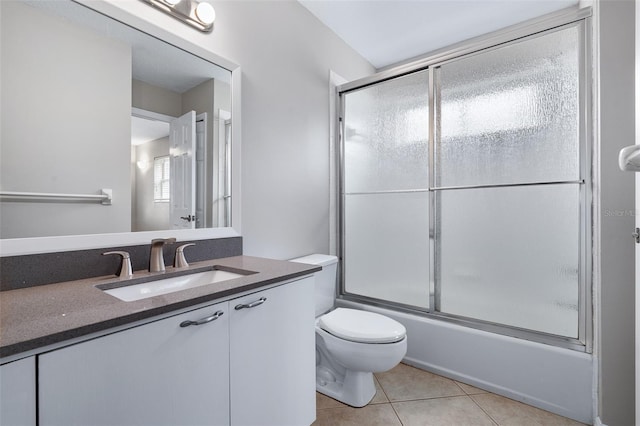 1115 N Central Ave, Flagler Beach, FL 32136 - bathroom featuring vanity, bath / shower combo with glass door, and tile patterned flooring