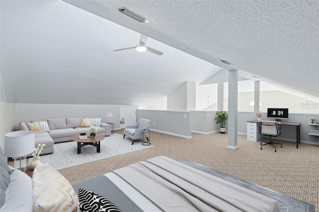 1115 N Central Ave, Flagler Beach, FL 32136 - bedroom featuring a textured ceiling, carpet flooring, vaulted ceiling, and ceiling fan