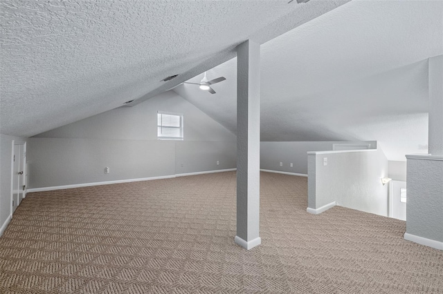 1115 N Central Ave, Flagler Beach, FL 32136 - additional living space featuring carpet flooring, lofted ceiling, a ceiling fan, and a textured ceiling