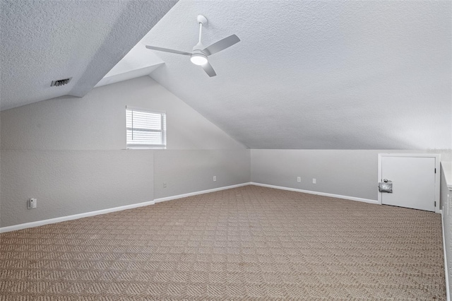 1115 N Central Ave, Flagler Beach, FL 32136 - bonus room with a textured ceiling, vaulted ceiling, carpet flooring, and a ceiling fan