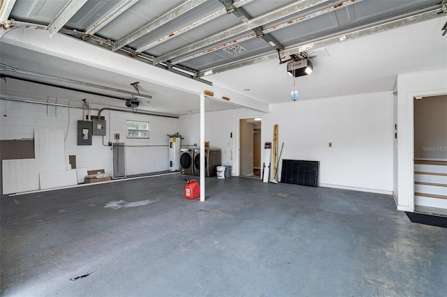1115 N Central Ave, Flagler Beach, FL 32136 - garage featuring independent washer and dryer, a garage door opener, electric water heater, and electric panel