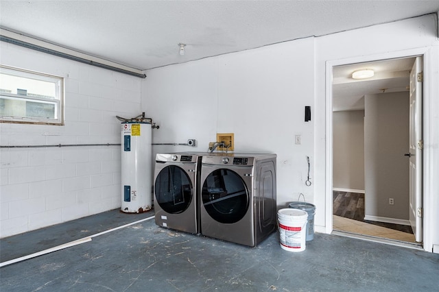 1115 N Central Ave, Flagler Beach, FL 32136 - laundry area featuring electric water heater, washer and dryer, and concrete block wall