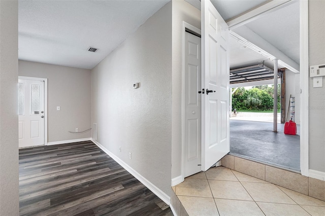 1115 N Central Ave, Flagler Beach, FL 32136 - entryway featuring a textured wall and wood finished floors