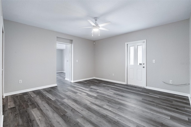 1115 N Central Ave, Flagler Beach, FL 32136 - spare room with a ceiling fan and dark wood-type flooring