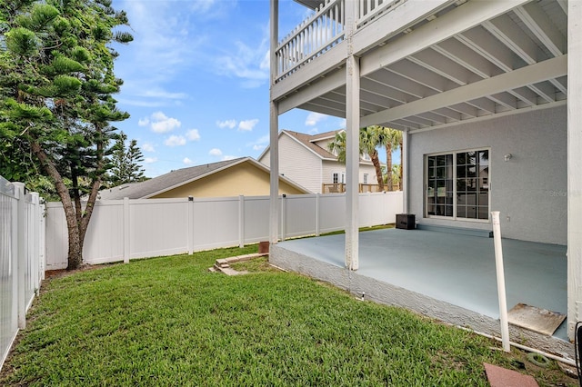 1115 N Central Ave, Flagler Beach, FL 32136 - fenced backyard featuring a patio and a balcony