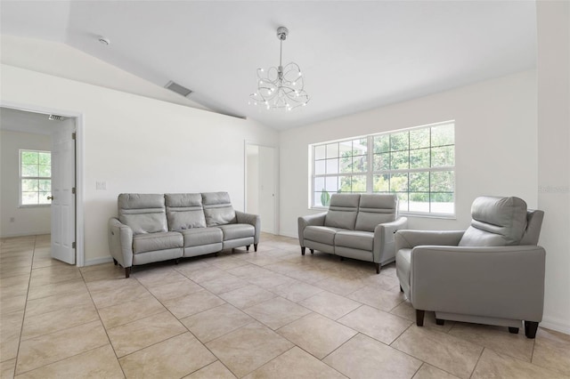 23 Pennfield Ln, Palm Coast, FL 32164 - living room featuring a chandelier, vaulted ceiling, healthy amount of natural light, and light tile patterned floors