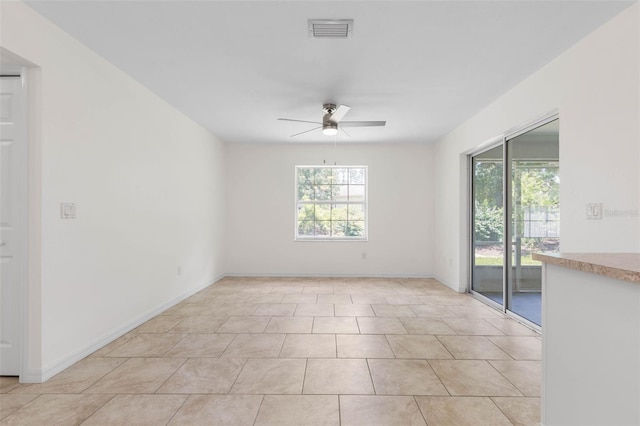 23 Pennfield Ln, Palm Coast, FL 32164 - unfurnished room featuring a ceiling fan and light tile patterned flooring