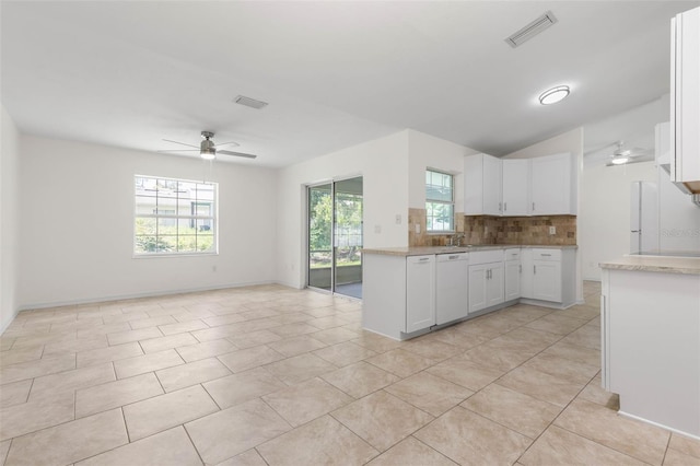 23 Pennfield Ln, Palm Coast, FL 32164 - kitchen featuring dishwasher, ceiling fan, decorative backsplash, and plenty of natural light