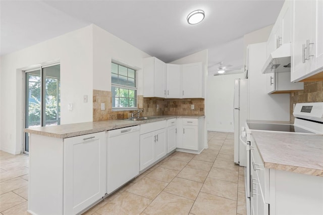 23 Pennfield Ln, Palm Coast, FL 32164 - kitchen featuring white appliances, under cabinet range hood, a peninsula, and light tile patterned flooring