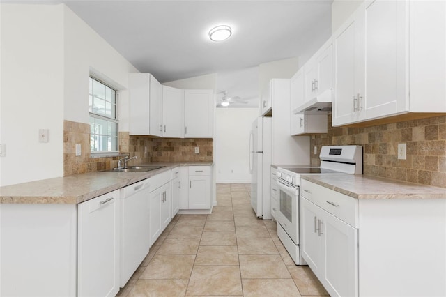 23 Pennfield Ln, Palm Coast, FL 32164 - kitchen with white appliances, under cabinet range hood, ceiling fan, backsplash, and white cabinetry