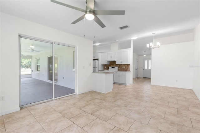 23 Pennfield Ln, Palm Coast, FL 32164 - unfurnished living room with a ceiling fan and a chandelier