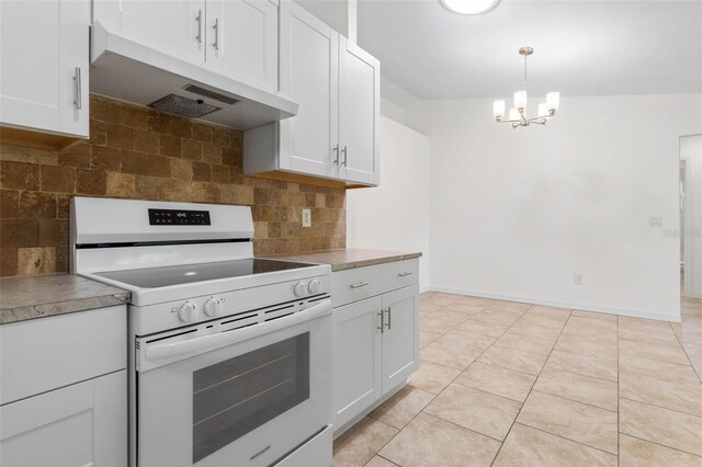 23 Pennfield Ln, Palm Coast, FL 32164 - kitchen featuring white electric range, under cabinet range hood, a chandelier, tasteful backsplash, and white cabinetry