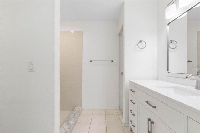 23 Pennfield Ln, Palm Coast, FL 32164 - full bath featuring vanity, tile patterned floors, and a tile shower