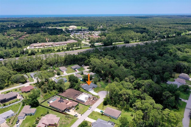 23 Pennfield Ln, Palm Coast, FL 32164 - aerial overview of property's location with a forest and nearby suburban area
