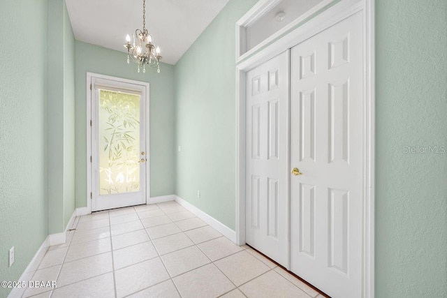 3132 Connemara Dr, Ormond Beach, FL 32174 - foyer entrance featuring a chandelier and light tile patterned floors