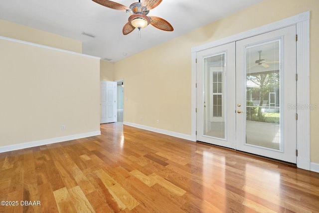 3132 Connemara Dr, Ormond Beach, FL 32174 - empty room featuring ceiling fan, light wood-style flooring, and french doors