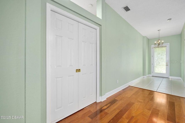 3132 Connemara Dr, Ormond Beach, FL 32174 - entryway with a chandelier and wood finished floors