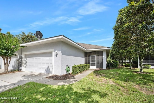3132 Connemara Dr, Ormond Beach, FL 32174 - view of side of home with an attached garage, stucco siding, a sunroom, a lawn, and driveway