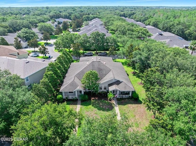 3132 Connemara Dr, Ormond Beach, FL 32174 - aerial perspective of suburban area with a heavily wooded area
