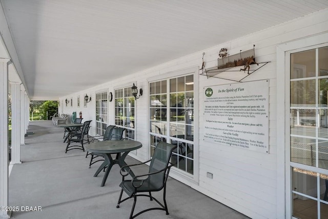 3132 Connemara Dr, Ormond Beach, FL 32174 - sunroom / solarium featuring finished concrete flooring