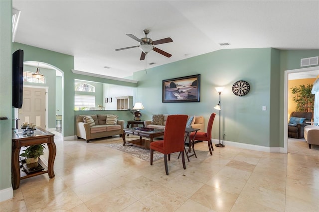 5 Senora Ct, Palm Coast, FL 32164 - living area featuring ceiling fan, lofted ceiling, arched walkways, and light tile patterned floors